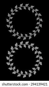 Set of 2 decorative round floral frames with leaves on black background