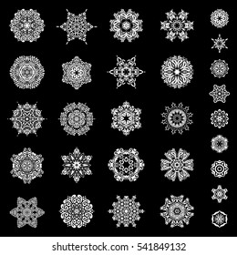 Set of 29 snowflakes, snowfall on a black background. Stock vector illustration falling snow.