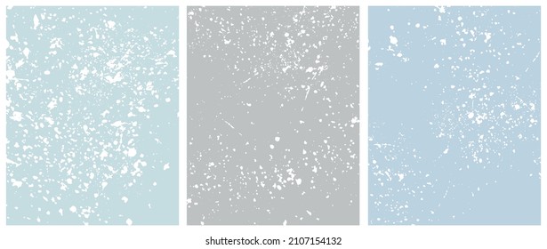 Set of 3 Abstract Style Vector Layouts. White Splatters and Stains on a Light Blue and Gray Background. Pastel Color Irregular Splashes Print.