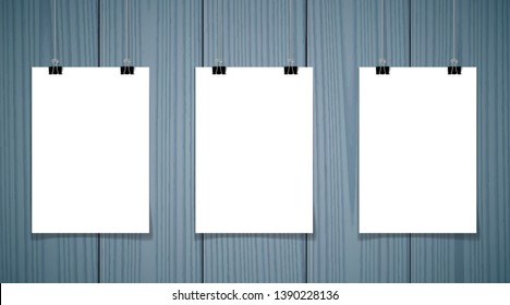 Set of 3 blank posters hanging on thread with clips