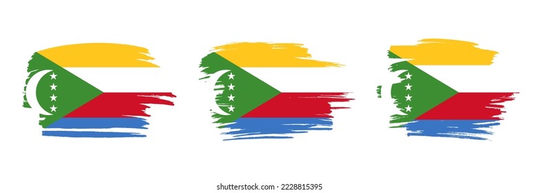 Set of 3 creative brush flag of Comoros with grungy stroke effect. Modern brush flags collection.