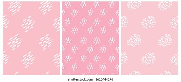 Set of 3 Cute Abstract Spots Vector Pattern. White Hand Drawn Brush Spots Isolated on a Pink Background. Lovely Pastel Color Geometric Vector Prints. Funny Infantile Style Repeatable Design.