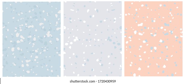 Set of 3 Cute Abstract Spots Vector Pattern. Irregular Splatter on a Salmon Pink, Light Gray and Light Blue Backgrounds. Lovely Pastel Color Seamless Print. Funny Infantile Style Design.