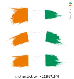 Set of 3 grunge textured flag of Ivory Coast, three versions of national country flag in brush strokes painted style. Vector flags.