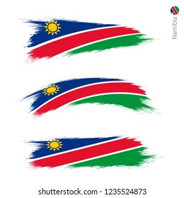 Set of 3 grunge textured flag of Namibia, three versions of national country flag in brush strokes painted style. Vector flags.