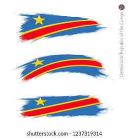 Set of 3 grunge textured flag of DR Congo, three versions of national country flag in brush strokes painted style. Vector flags.