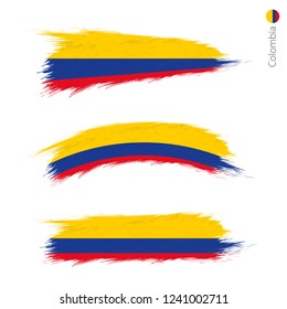 Set of 3 grunge textured flag of Colombia, three versions of national country flag in brush strokes painted style. Vector flags.