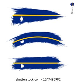 Set of 3 grunge textured flag of Nauru, three versions of national country flag in brush strokes painted style. Vector flags.