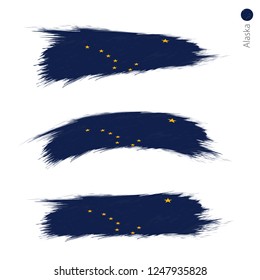 Set of 3 grunge textured flag of US State Alaska, three versions of state flag in brush strokes painted style. Vector flags.