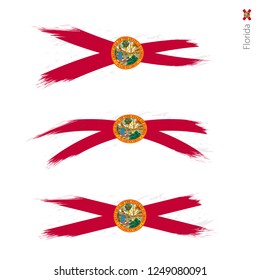 Set of 3 grunge textured flag of US State Florida, three versions of state flag in brush strokes painted style. Vector flags.