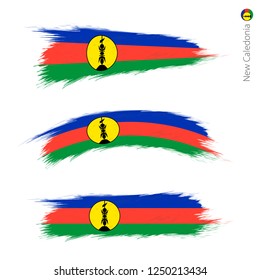 Set of 3 grunge textured flag of New Caledonia, three versions of national country flag in brush strokes painted style. Vector flags.