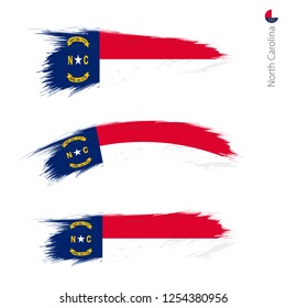Set of 3 grunge textured flag of US State North Carolina, three versions of state flag in brush strokes painted style. Vector flags.