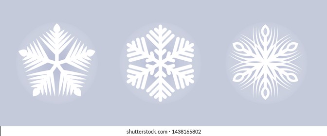 Set of 3 white christmas paper cut snowflakes on a blue background. Christmas design elements. Vector illustration.