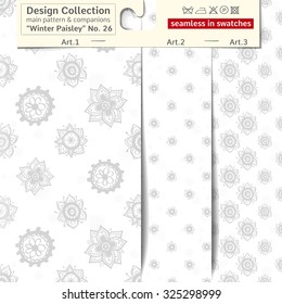 Set of 3 winter paisley vector seamless patterns: main pattern with flower and daisy and two companions. Performed as textile sampler on hanger. Seamless patterns inside EPS file in swatches panel