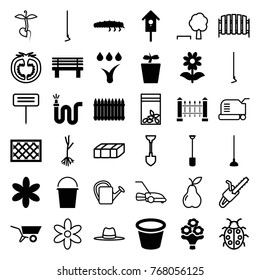 Set of 36 garden filled and outline icons such as flower, shovel, hoe, water hose, pot for plants, plant in pot, bench, fence, nesting house, caterpillar, sprout
