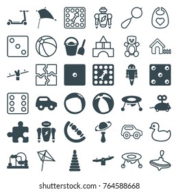 Set of 36 toy filled and outline icons such as baby toy, swing, robot, board game, beach ball, bucket and shovel, teddy bear, duck, beanbag, whirligig, baby bid, kite, house