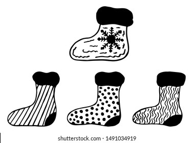 Set of 4 black and white hand-drawn Christmas socks. Scandinavian style. Vector illustration on a white background.