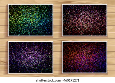 Set of 4 colorful colored confetti on a black background. The substrate is a wooden Board