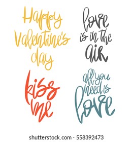 Set of 4 decorative handdrawn lettering. Modern ink calligraphy. Handwritten colorful Valentines Day phrases isolated on white background. Trendy vector design elements for decor, cards and posters