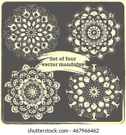Set of 4 hand drawn mandalas. Vintage style elements with grunge effect.  Indian, asian, arabic, islamic, ottoman motif. Vector illustration. 