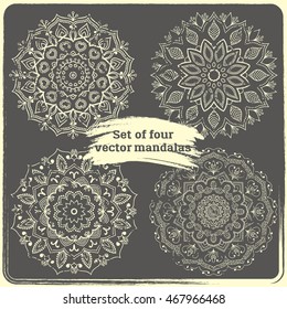 Set of 4 hand drawn mandalas. Vintage style elements with grunge effect.  Indian, asian, arabic, islamic, ottoman motif. Vector illustration. 