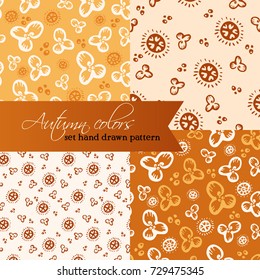 Set of 4 hand drawn patterns in autumn colors. Vector pattern with hand drawn floral elements
