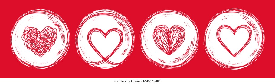 Set of 4 heart tangled grungy scribble in an ink circle hand drawn with brush. Isolated on white background. Vector illustration