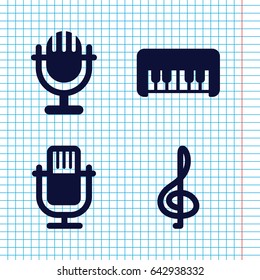 Set of 4 musical filled icons such as piano toy, microphone