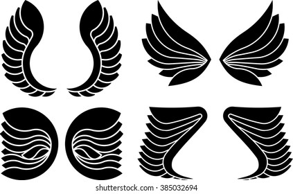 Set of 4 pair of decorative vector wings isolated on white.