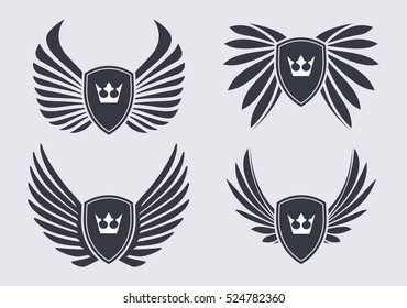 Set of 4 pair of stylish decorative vector wings with shields and crowns