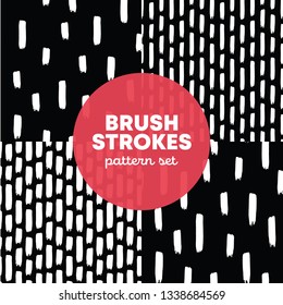 Set of 4 seamless patterns of white vertical strokes on black. Hand-drawn vector illustration. Abstract dab geometry shapes on black backgdrop. Maded for different cards and packaging.