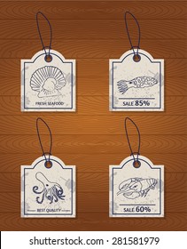set of 4 vintage design elements seafood. Lobster, oyster, scallop, cuttlefish and octopus