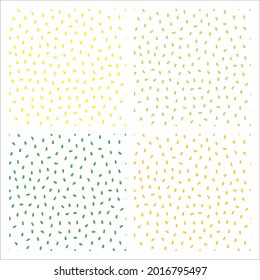Set of 4 white seamless patterns with green and yellow sprinkles.