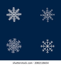 Set of 4 white snowflakes. White snowflakes on navy blue background. Vector snowflakes icon set for your design, pattern and more.