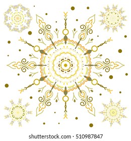 Set with 5 snowflakes, doodles and dots in yellow colors on a white background. Watercolor painting effect. Handmade drawing. For the Christmas design and decoration.