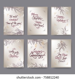 Set of 6 A4 format Christmas greeting cards with mistletoe, pine branches and holiday brush lettering on silver background. Great for greeting cards and holiday design.