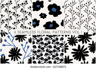 Un conjunto de seis motivos florales pintados a mano en negro y azul sobre fondo crema. Textil abstracto, envoltura de regalo, diseño de arte mural.