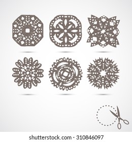 Set of 6 vector snowflakes.; with scratches on grey background. Silhouette. Handmade; paper cut with scissors. Old style hobby preparation for New year and Christmas Holidays.