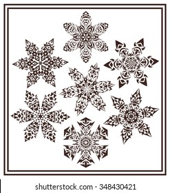 Set of 7 black elegant geometric snowflake shapes isolated on white background.Collection of winter ornamental snowflake decorations.Monochrome symmetric snowflake elements essential for winter design