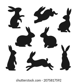 Set of 8 black rabbits, hares, bunnies. Vector illustration in flat style is isolated on white background.