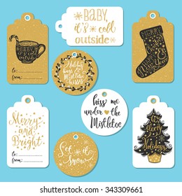 Set of 8 creative Christmas gold and white hand drawn gift tags. Cup of hot chocolate with peppermint lollipop, Christmas sock, Christmas tree, mistletoe wreath, handwritten lettering