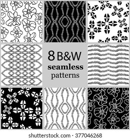 Set of 8 hand drawn ethnic seamless black and white seamless patterns. Aboriginal arts motifs, boho elements, fantasy flowers, waves, lines, abstract ornaments. Ethnic textile collection.
