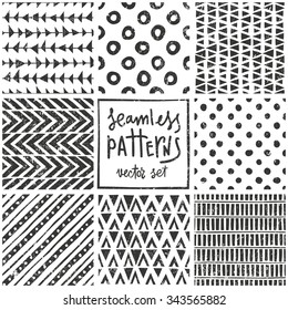 Set of 8 primitive geometric patterns. Tribal seamless background. Stylish trendy print. Modern abstract wallpaper with grunge texture. Vector illustration EPS10.