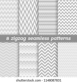 Set of 8 seamless vector patterns with light grey zigzag tracery in flat style