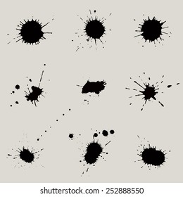 Set of 9 black blots and ink splashes. Grunge texture.
