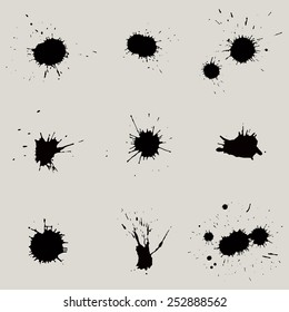 Set of 9 black blots and ink splashes. Grunge texture.