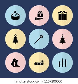 Set of 9 christmas filled icons such as sparklers, christmas tree, present, candle, gift on hand, socks, snowflake