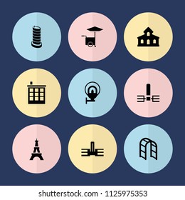 Set of 9 city filled icons such as building, eiffel tower, school, playground ladder, street lamp, business center building