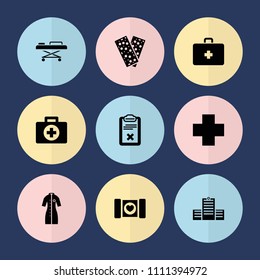 Set of 9 cross filled icons such as bandage, clipboard, medical cross, first aid, case with heart, hospital, nurse gown, first aid kit