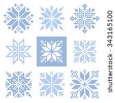 Set of 9 cross-stitch snowflakes pattern, Scandinavian style. Geometric  ornament for embroidery.  Perfect for Christmas design.   Vector illustration